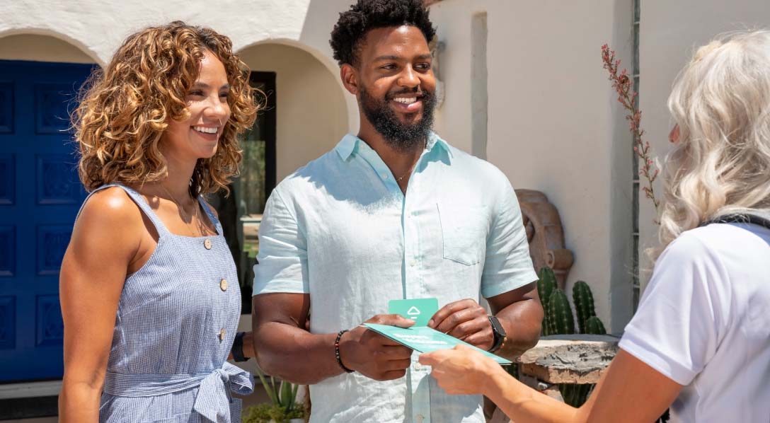 couple speaking with an agent