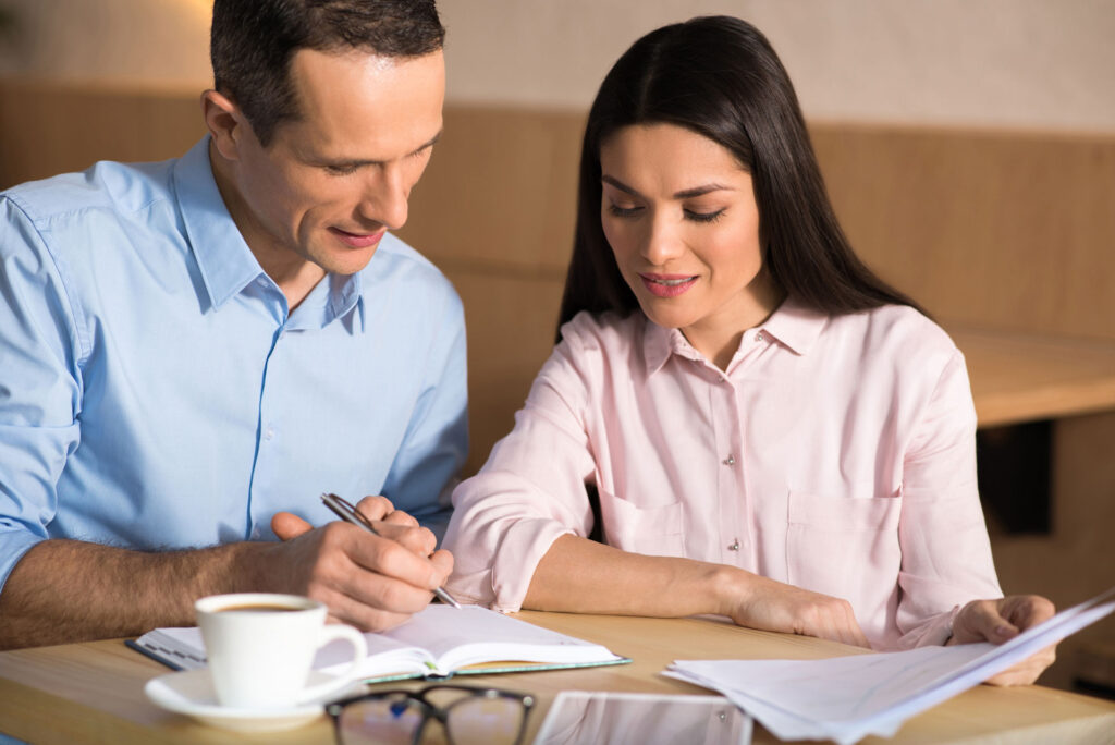 couple going over timeline for selling and buying a house at the same time