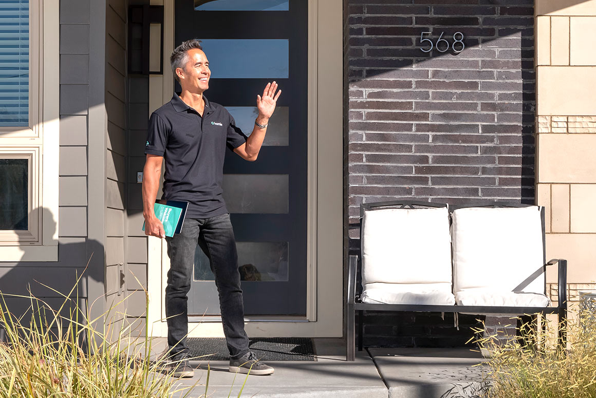 homie buyer's agent meeting buyers at the door of a dream home for a tour