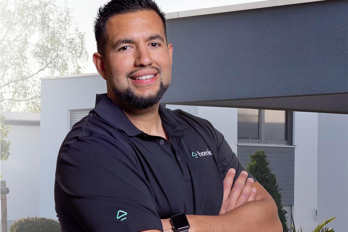 headshot of juan gomez in a homie polo shirt