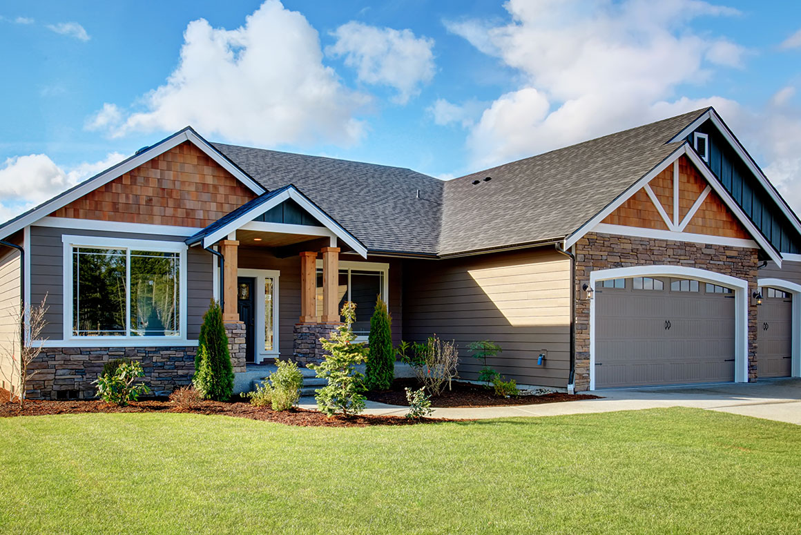 A home with a yard and blue skies