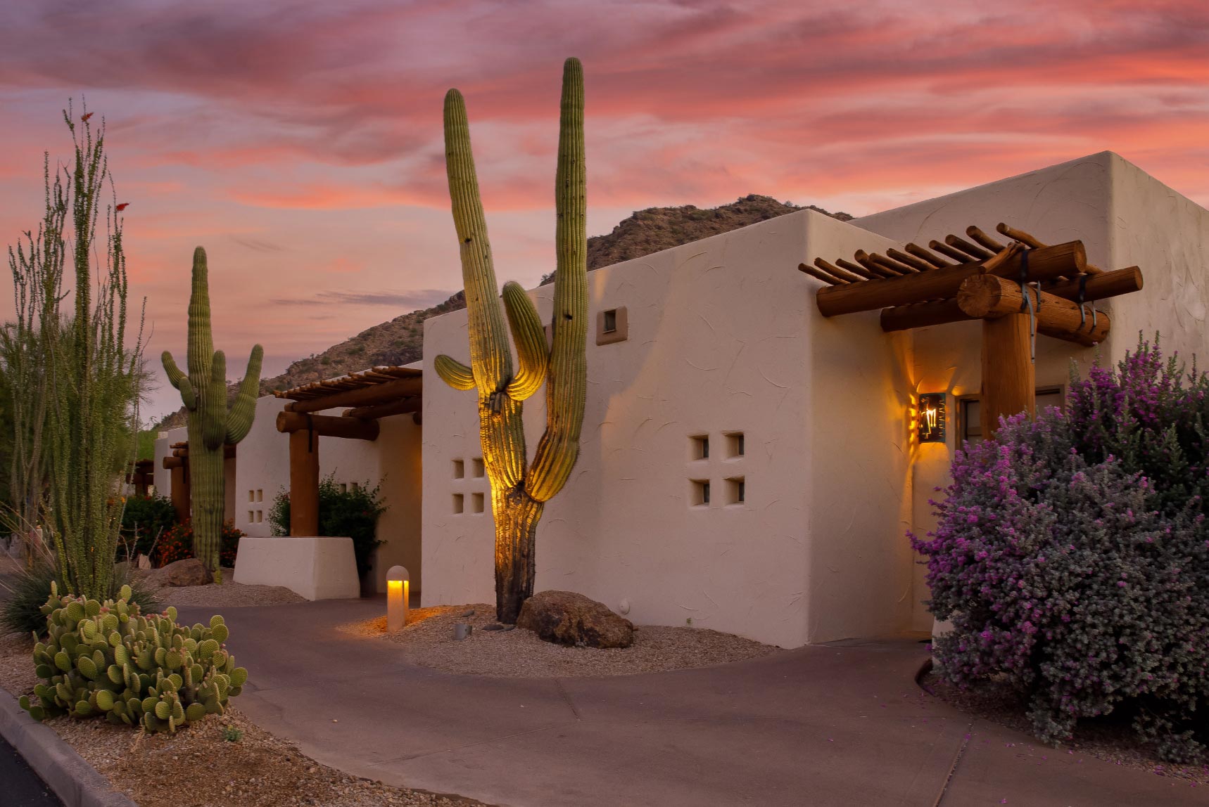 Arizona home with cactus in front of a sunset