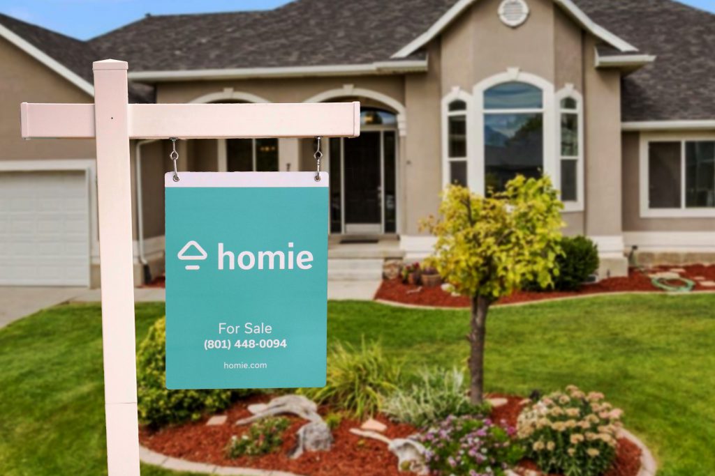 house with homie for sale sign